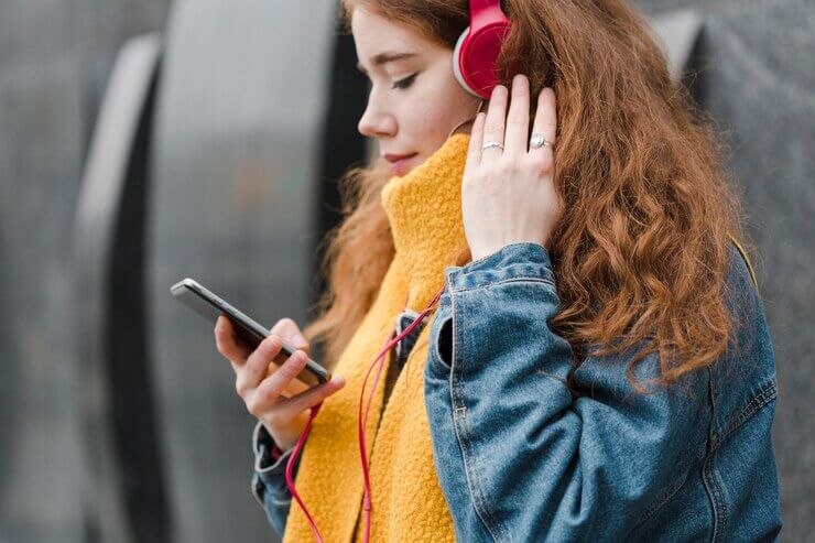 Motorola Radios: close-up cute young girl listening to music