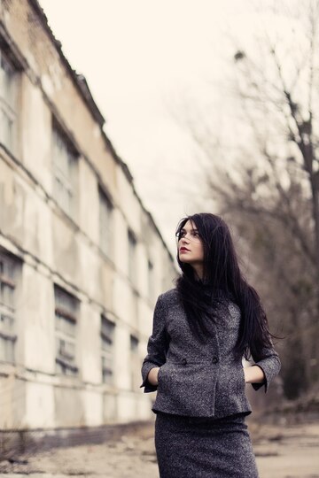 Pensive woman with long hair in a fall day