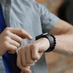 Coach Apple Watch Bands, hands of a man pointing watch on his wrist with forefinger