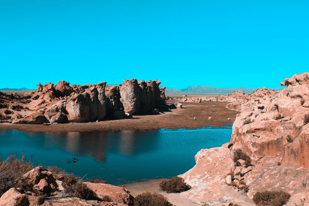 Λιβαισ:the Enigma: shot of a lake on the middle of a desert on a sunny day