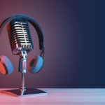 Podcasting and radio concept with retro microphone and headphones on empty wooden table and dark blank wall background with place for your logo or text 3D rendering mock up