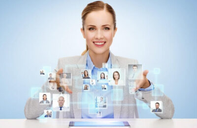 Business, technology, cooperation, people and hiring concept - smiling businesswoman with tablet pc computer over blue background with icons of contacts