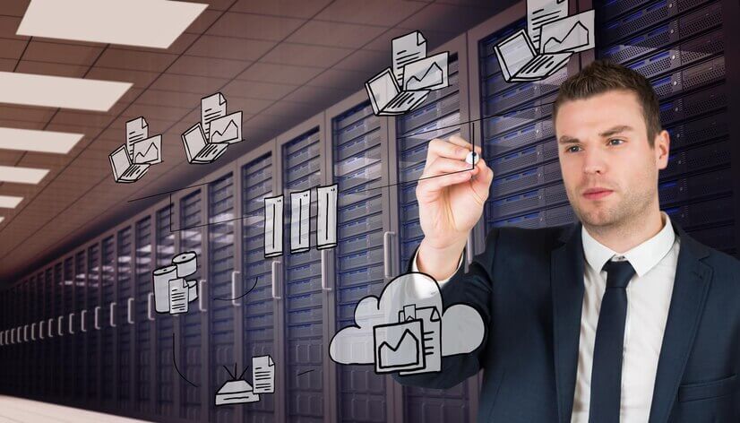 Young businessman writing with marker against digitally generated server room with towers
