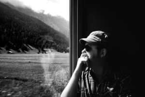 Man looking through window