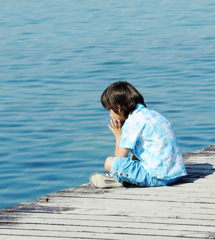 child-by-wooden-dock-beautiful-sea