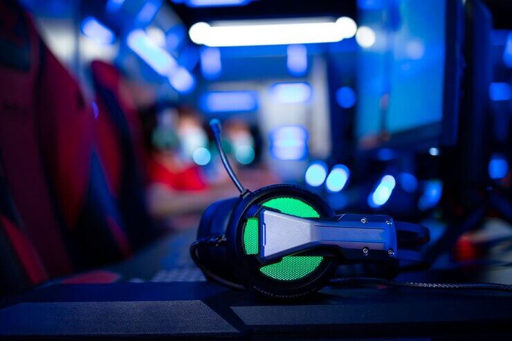 Close up view of professional headset and high performance computer for video games in game room