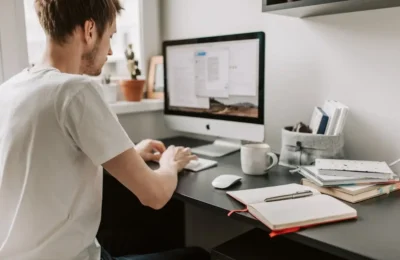 Photo Of Man Using Computer