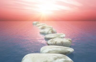 stepping-stones-ocean-against-sunset