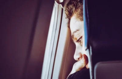 Close-Up Photo of Man Looking Down from the window