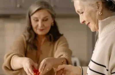 A Side View of an Elderly Woman in Turtle Neck Sweater Preparing a Food