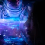 Woman in a Space Helmet Illuminated in Blue