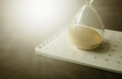 Still Life with a Calendar and a Sandglass