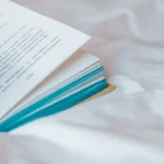 Photo of a Book on White Textile More info Share More like this