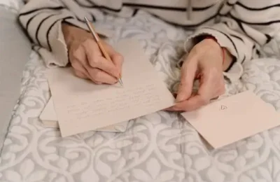 A Person Writing a Letter