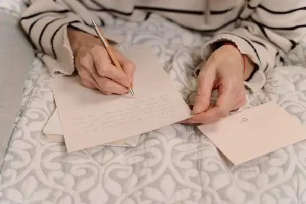 A Person Writing a Letter