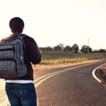 Backside of man with traveling, Facing Road,