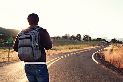 Backside of man with traveling, Facing Road,