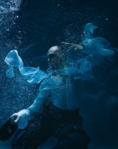 Man in Shirt Posing Underwater 