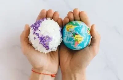 Having world globes in hands