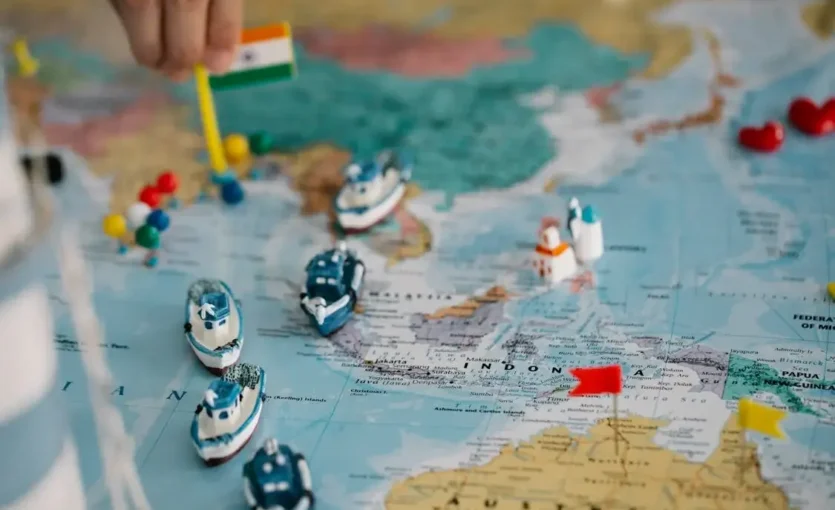 Tiny Ships and Flags on World Map