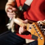 Close up musician playing the guitar