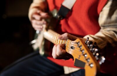 Close up musician playing the guitar