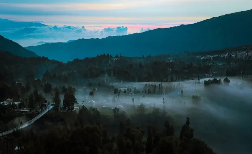 Aerial View of a Mountain Valley in Fog