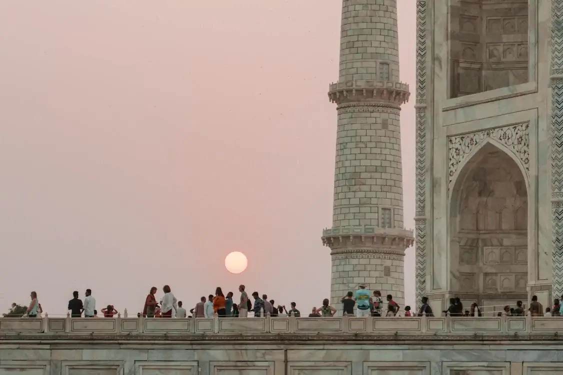 People on Concrete Building during Sunset