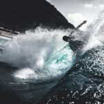 Person Surfing on Sea Waves