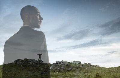 Businessman with landscapes on background, double exposure.