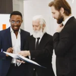 Businessmen Looking at Documents