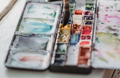 Top View of a Person Painting an Artwork More info Share More like this