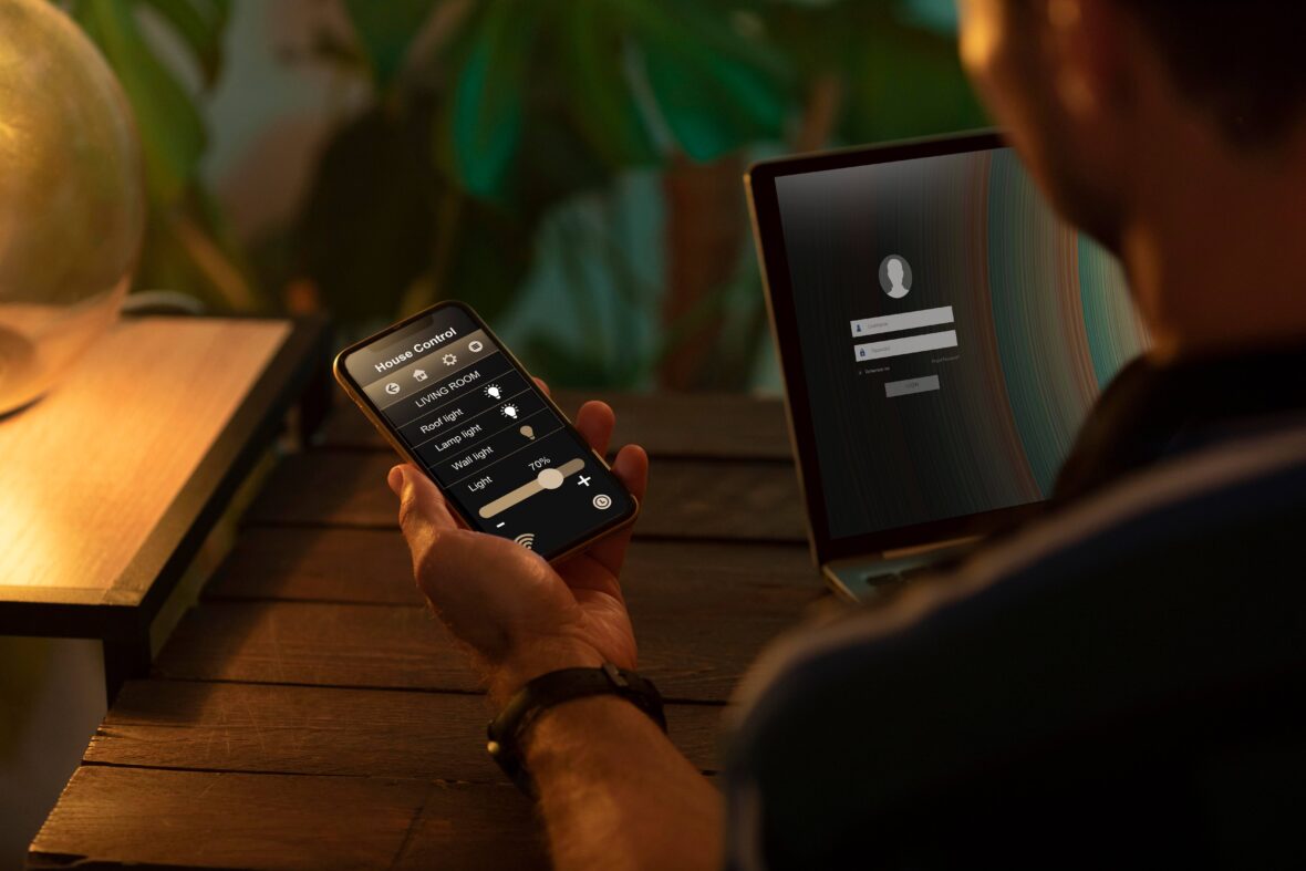 person-using-smartphone-his-automated-home