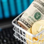 Gold Bitcoin Coins and Cash in a Miniature Shopping Cart