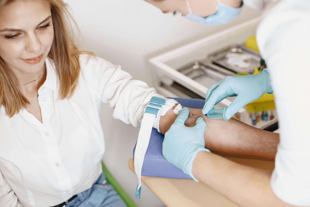 Wellness check, a woman giving blood for test