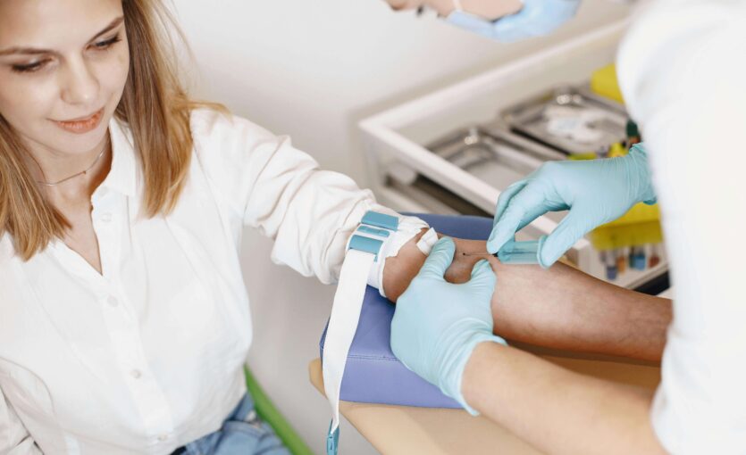 Wellness check, a woman giving blood for test