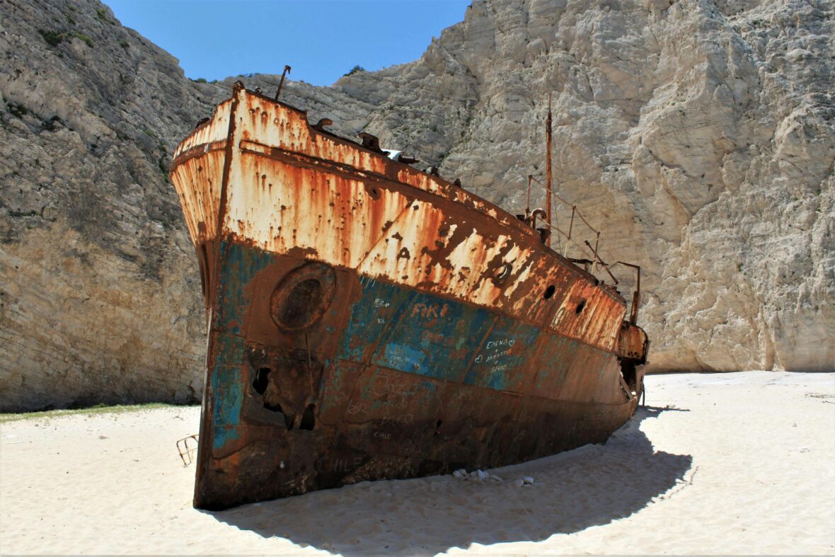 Broken ship beside the mountain