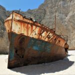 Broken ship beside the mountain